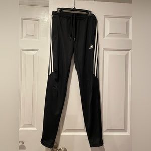 Black Adidas climacool Tiro 21 Track Pants with 3 strips and zipper ankles.